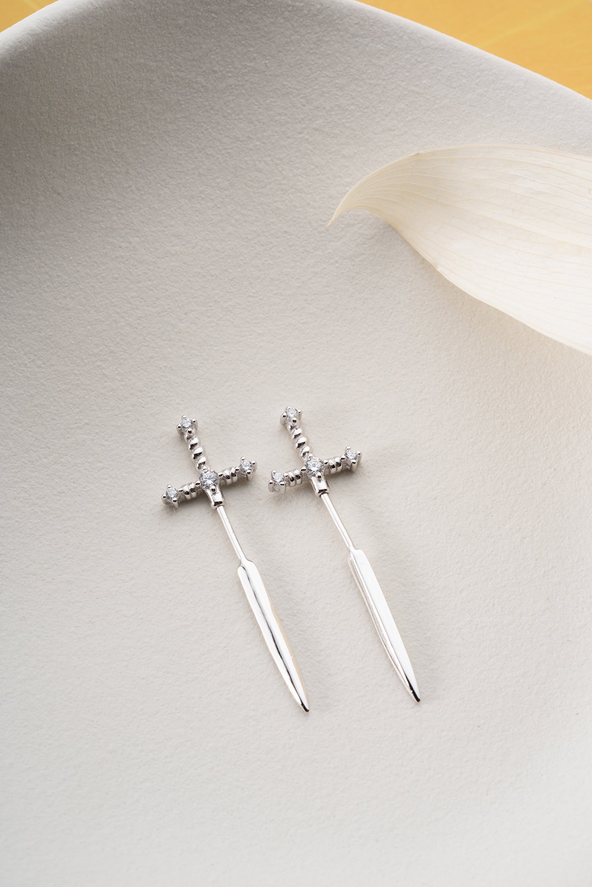 Silver sword earrings with zirconia stones