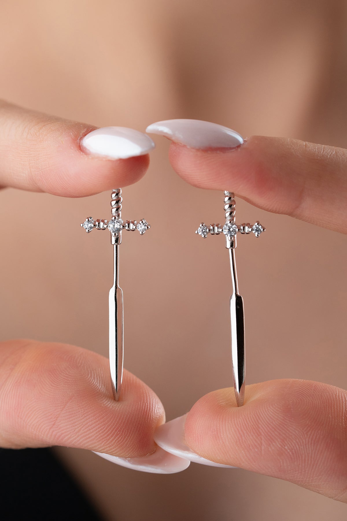 Silver sword earrings with zirconia stones