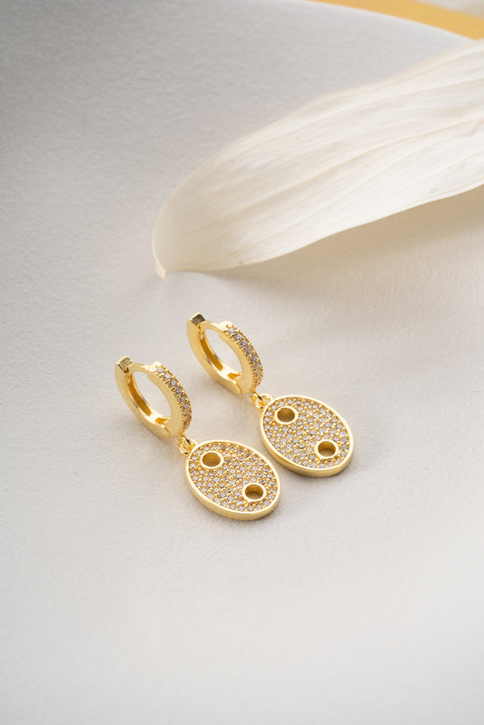 Oval gold earrings with zirconia stones