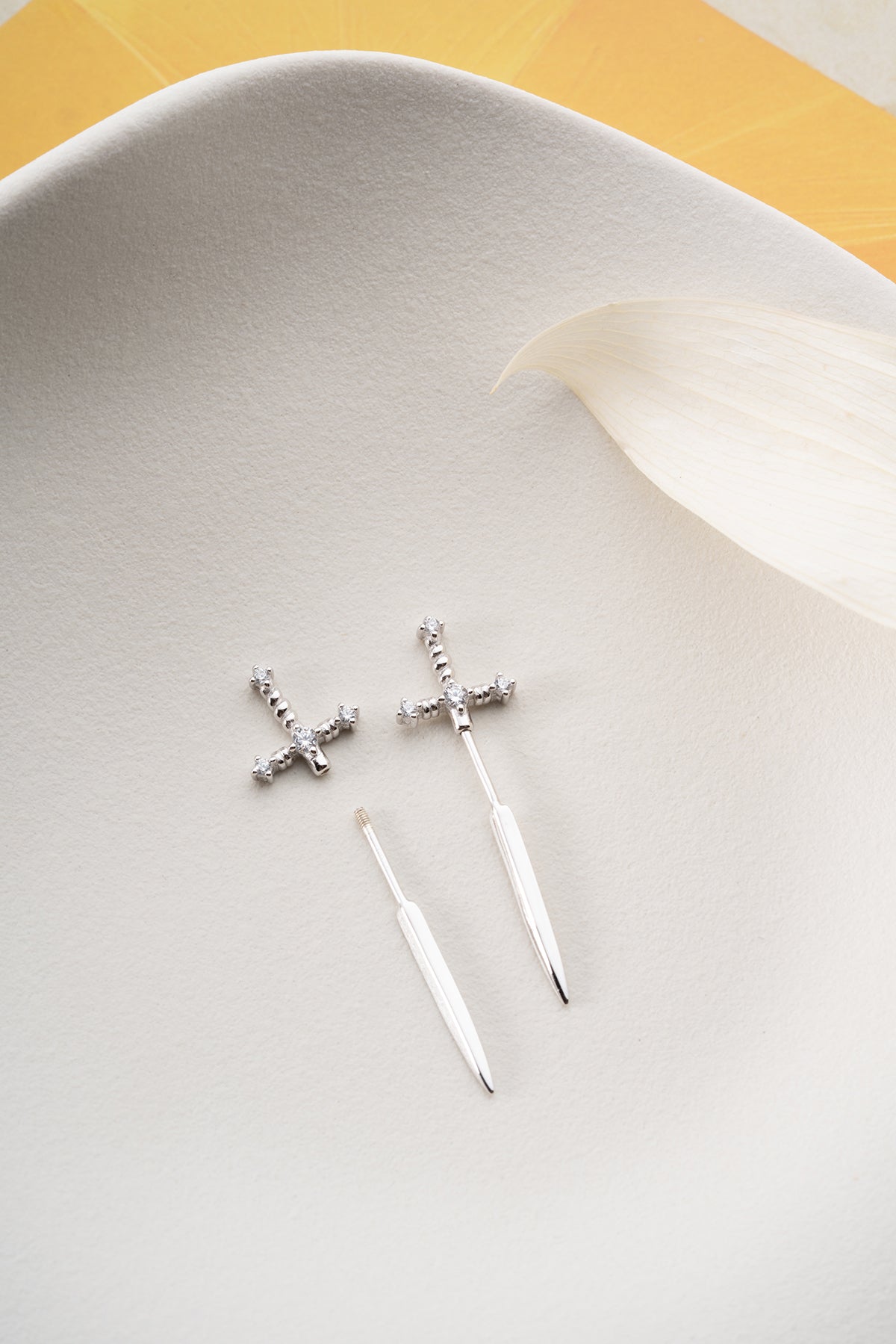 Silver sword earrings with zirconia stones