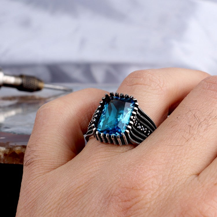 Silver men's ring with blue stone