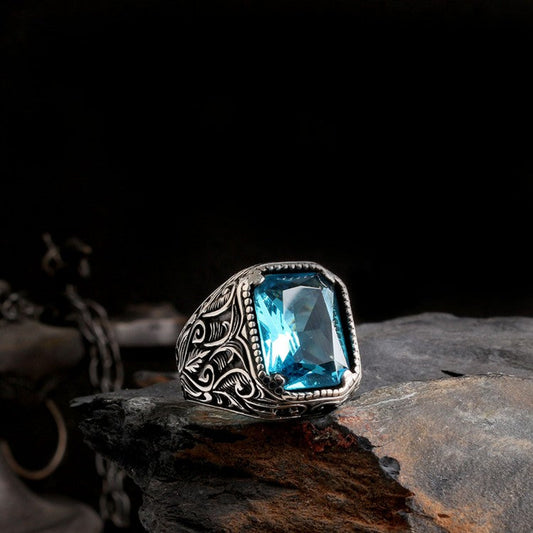 Silver men's ring with blue stone